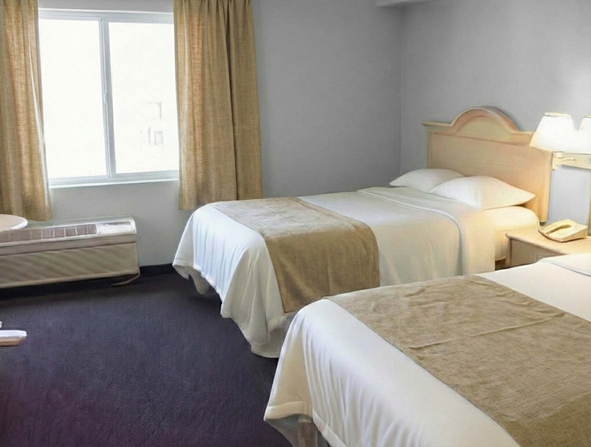 Comfortable courtyard room with two queen beds at waterfront resort